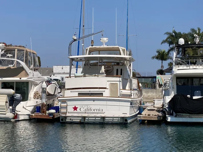  Yacht Photos Pics 1985 Offshore Yachts 48 Yachtfisher docked at marina, Newport Beach, California.