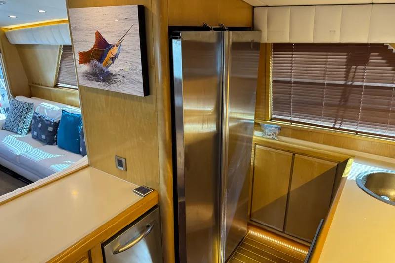  Yacht Photos Pics Interior of a 1996 Bertam Convertible yacht with modern kitchen and stylish decor.