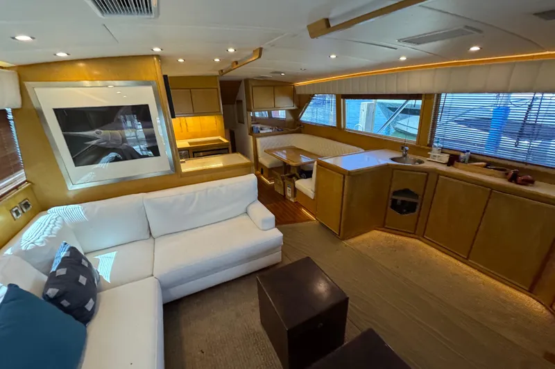  Yacht Photos Pics Luxurious interior of a 1996 Bertam Convertible yacht with modern furnishings and ample natural light.