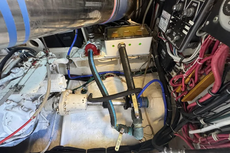  Yacht Photos Pics Engine room of a 1996 Bertam Convertible boat with visible wiring and components.