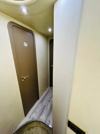  Yacht Photos Pics Interior hallway of a 1997 Azimut 54 yacht with wooden doors and modern lighting.