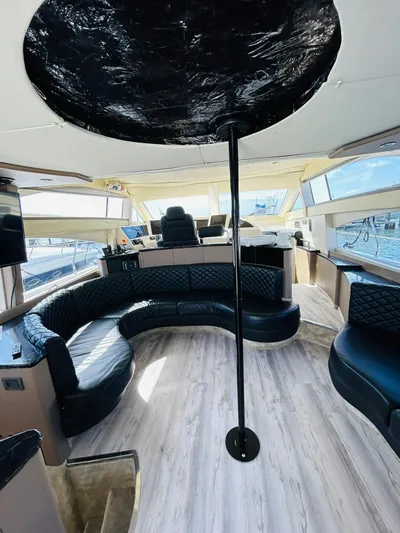  Yacht Photos Pics Luxurious interior of a 1997 Azimut 54 yacht with modern seating and panoramic windows.