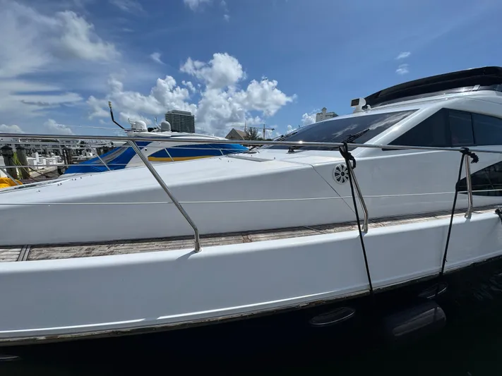  Yacht Photos Pics 1997 Azimut 54 yacht docked under a clear blue sky.