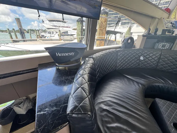  Yacht Photos Pics Luxurious interior of a 1997 Azimut 54 yacht with leather seating and Hennessy display.