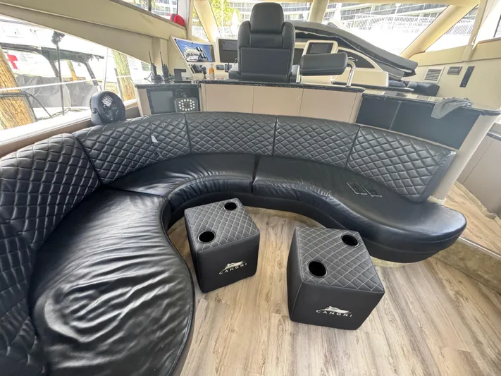  Yacht Photos Pics Luxurious interior of a 1997 Azimut 54 yacht with black leather seating and modern helm.