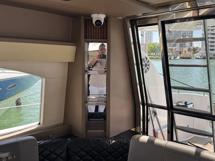  Yacht Photos Pics Interior of a 1997 Azimut 54 yacht with waterfront view and modern furnishings.