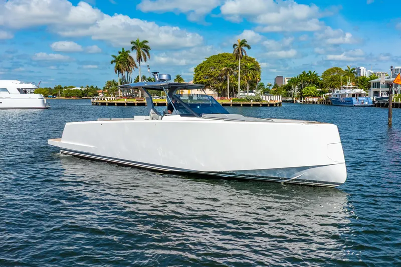  Yacht Photos Pics 2021 Pardo Yachts 43 cruising on a sunny day with palm trees in the background.