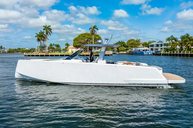  Yacht Photos Pics 2021 Pardo Yachts 43 cruising on a sunny day with palm trees in the background.