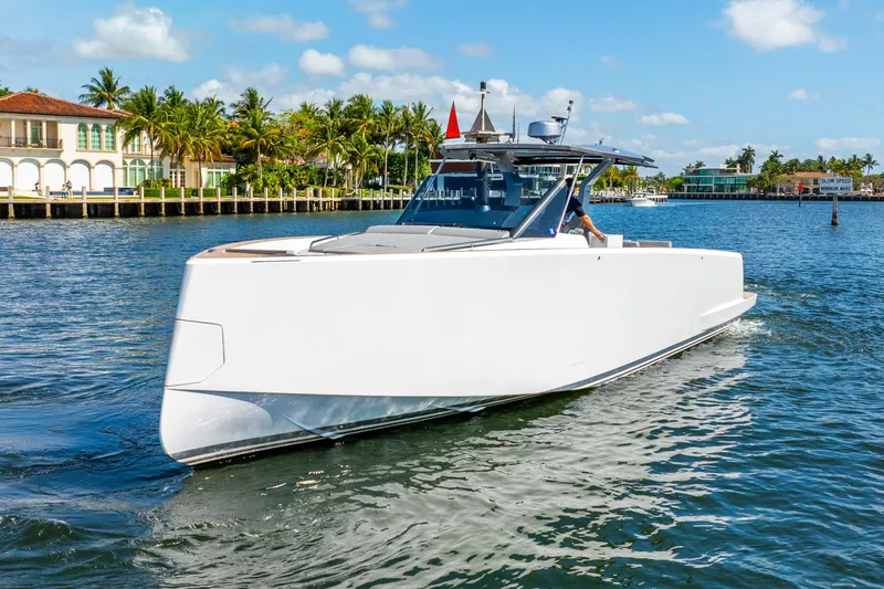  Yacht Photos Pics 2021 Pardo Yachts 43 cruising on a sunny day near waterfront homes.