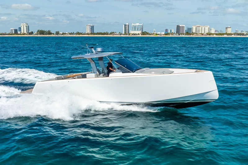  Yacht Photos Pics 2021 Pardo Yachts 43 cruising on blue ocean near city skyline.