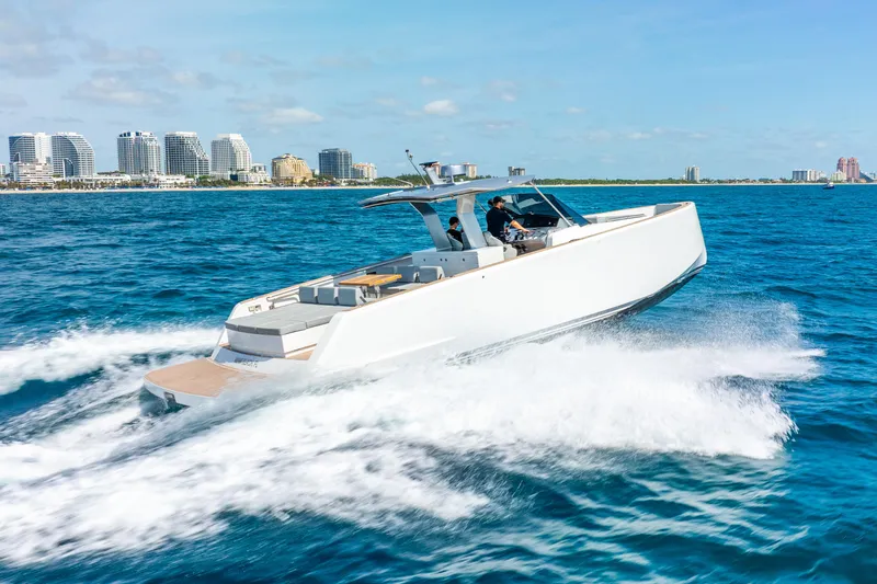  Yacht Photos Pics 2021 Pardo Yachts 43 cruising on blue ocean near modern city skyline.