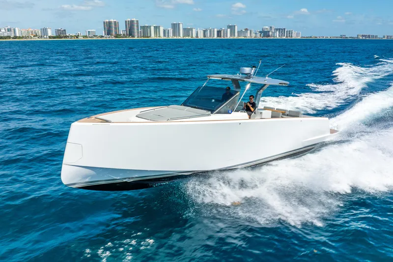  Yacht Photos Pics 2021 Pardo Yachts 43 cruising on blue ocean near city skyline.