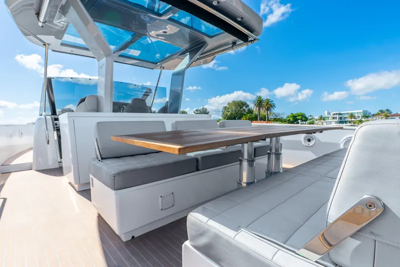  Yacht Photos Pics Luxury 2021 Pardo Yachts 43 with sleek seating and table, under clear blue skies.