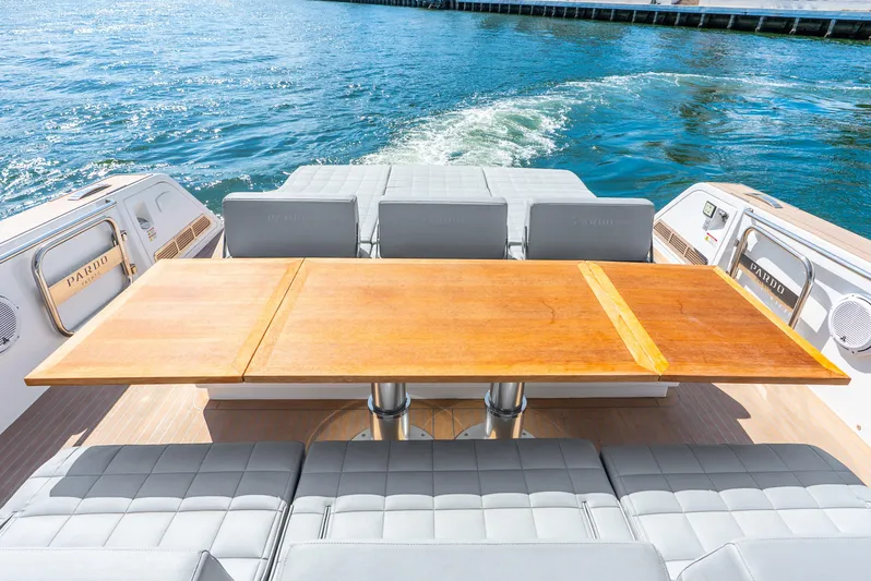  Yacht Photos Pics Luxury Pardo Yachts 43, 2021 model, featuring elegant deck seating and wooden table.