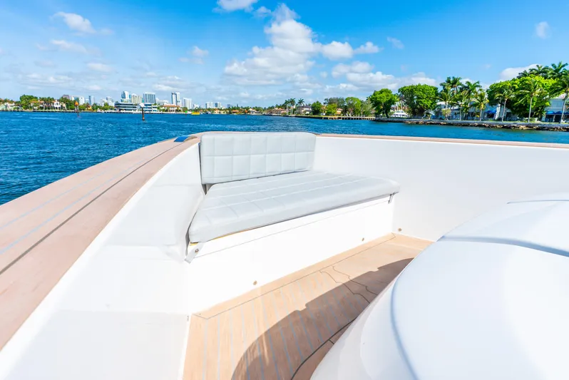  Yacht Photos Pics Pardo Yachts 43 (2021) with cushioned seating, overlooking scenic waterfront and skyline.