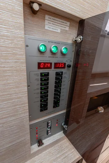  Yacht Photos Pics Electrical control panel on a 2021 Pardo Yachts 43, featuring illuminated switches and digital displays.