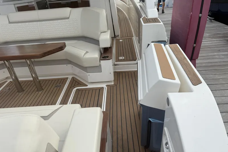  Yacht Photos Pics 2023 Tiara Yachts 48 LS interior with elegant seating and wooden flooring.