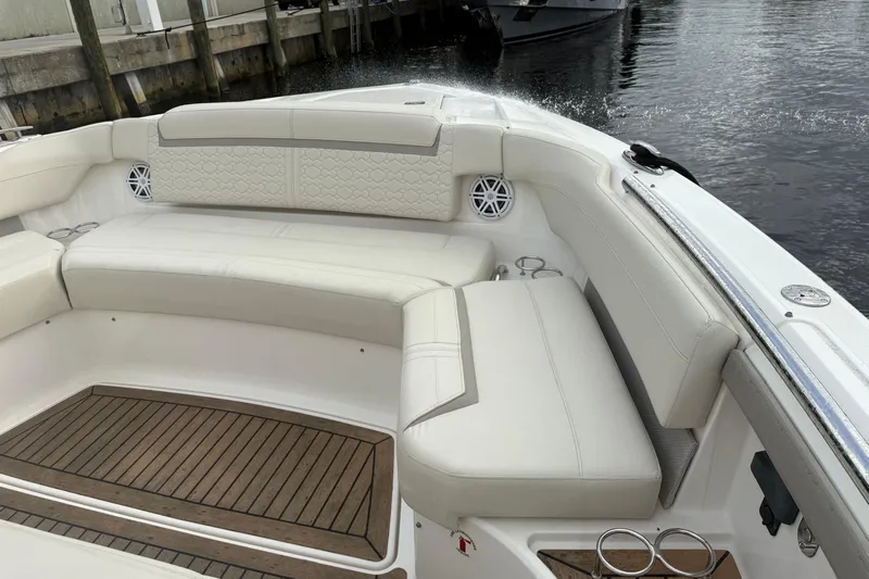  Yacht Photos Pics Luxurious seating area on 2023 Tiara Yachts 48 LS with elegant white upholstery.