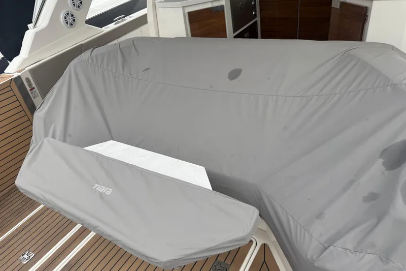  Yacht Photos Pics 2023 Tiara Yachts 48 LS with protective cover on deck.