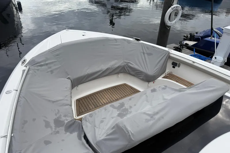  Yacht Photos Pics 2023 Tiara Yachts 48 LS boat with covered seating area at dock.