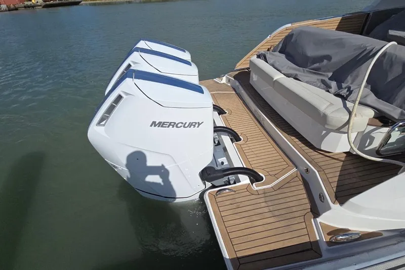  Yacht Photos Pics 2023 Tiara Yachts 48 LS with Mercury outboard engines on teak deck.