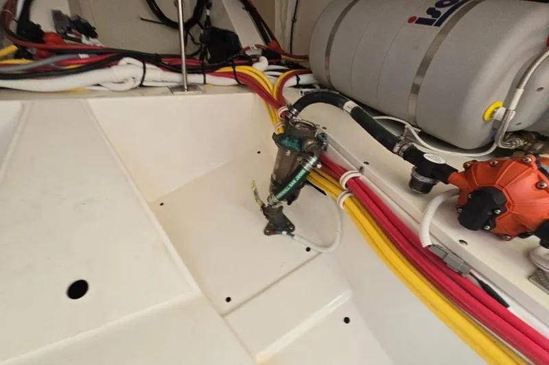  Yacht Photos Pics Engine compartment of 2023 Tiara Yachts 48 LS, showcasing wiring and components.