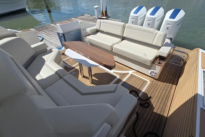  Yacht Photos Pics Luxurious seating area on 2023 Tiara Yachts 48 LS with elegant wood accents.