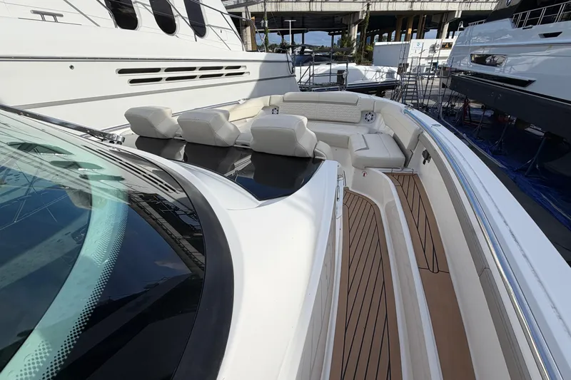  Yacht Photos Pics 2023 Tiara Yachts 48 LS luxury boat with spacious seating and sleek design.