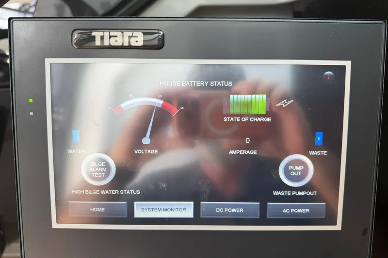  Yacht Photos Pics Tiara Yachts 48 LS 2023 control panel displaying battery status and system monitor.
