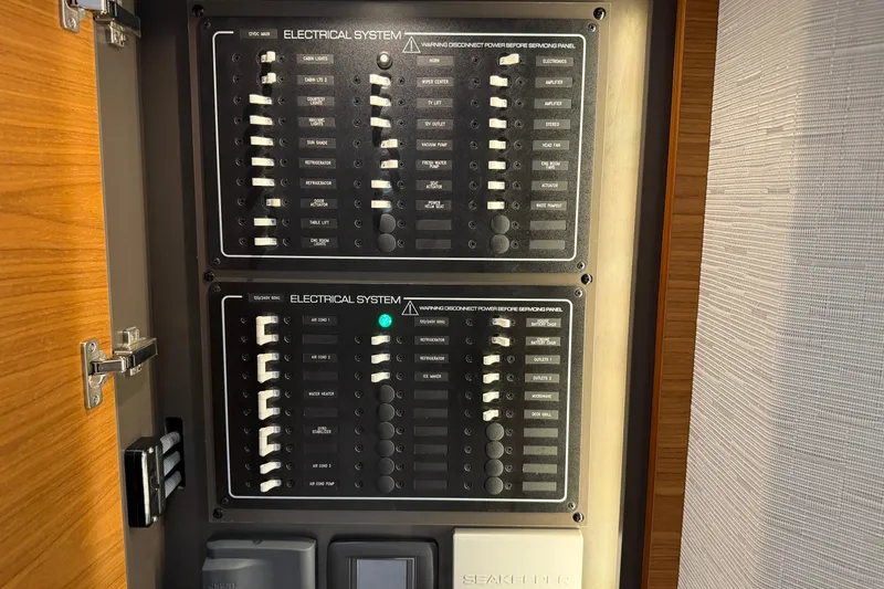  Yacht Photos Pics Electrical panel of 2023 Tiara Yachts 48 LS, showcasing switches and controls.