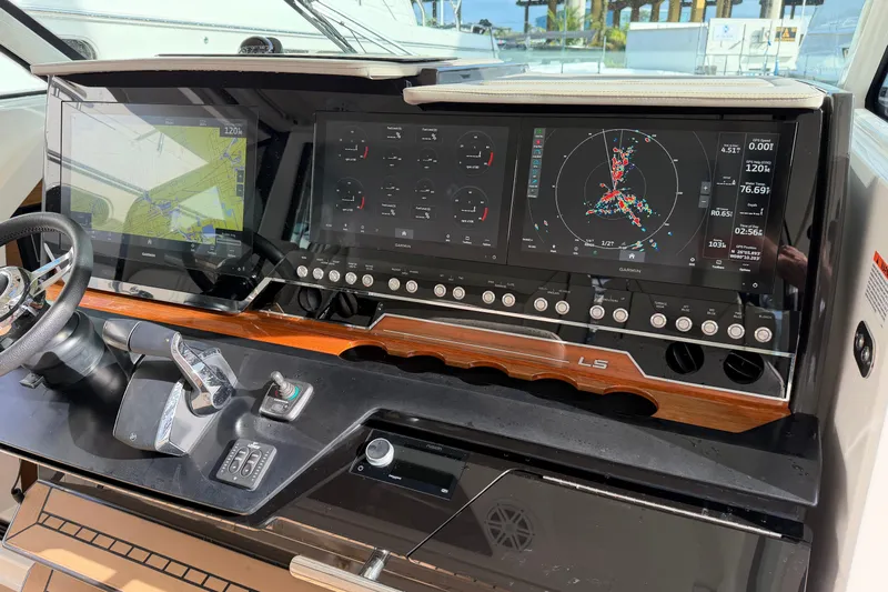 Yacht Photos Pics 2023 Tiara Yachts 48 LS helm with advanced navigation displays and controls.