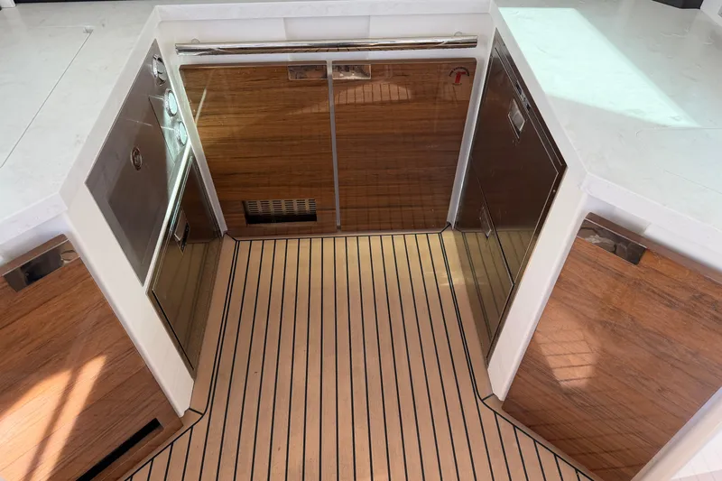  Yacht Photos Pics 2023 Tiara Yachts 48 LS interior with sleek wood cabinetry and modern design.