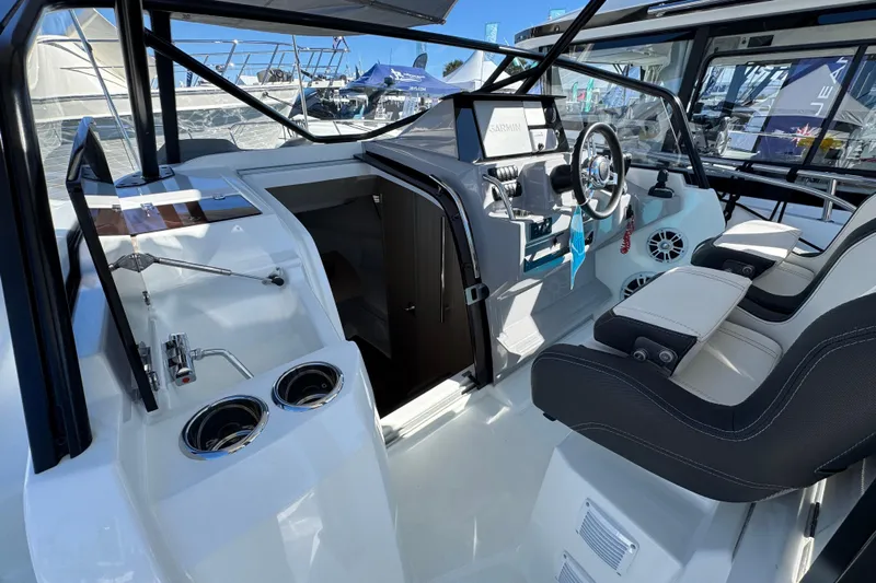  Yacht Photos Pics 2024 Jeanneau Leader 9.0 WA Series 2 cockpit with modern helm and seating.