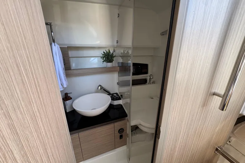  Yacht Photos Pics 2024 Jeanneau Leader 9.0 WA Series 2 bathroom with modern sink and sleek design.