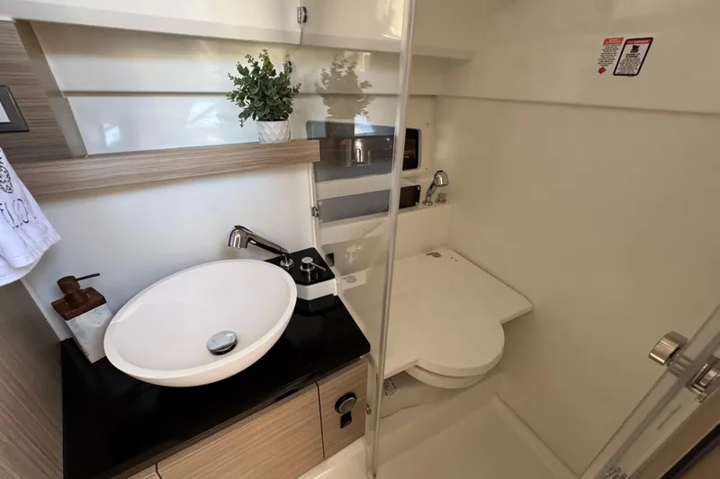  Yacht Photos Pics 2024 Jeanneau Leader 9.0 WA Series 2 bathroom with modern sink and toilet.