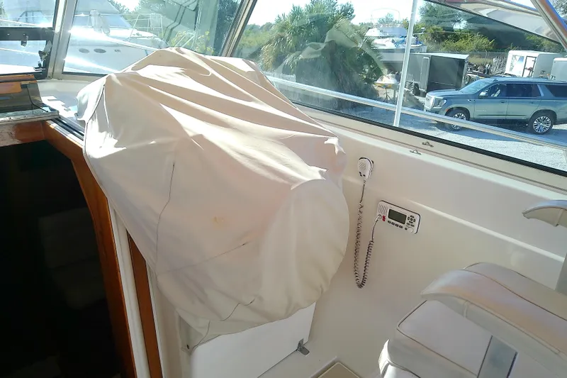 Kathrine E. Yacht Photos Pics Interior of 2002 Sabreline 36 Express boat with covered helm and radio equipment.