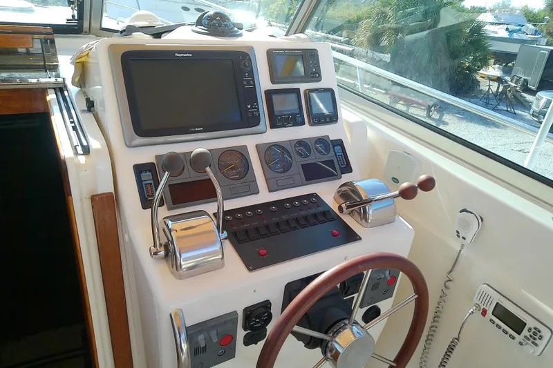 Kathrine E. Yacht Photos Pics Helm of 2002 Sabreline 36 Express boat with navigation equipment and controls.