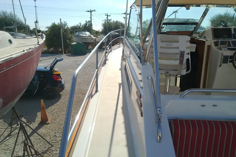 Kathrine E. Yacht Photos Pics 2002 Sabreline 36 Express boat docked, showcasing deck and cockpit area.