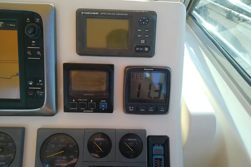 Kathrine E. Yacht Photos Pics Boat dashboard with navigation instruments on a 2002 Sabreline 36 Express.