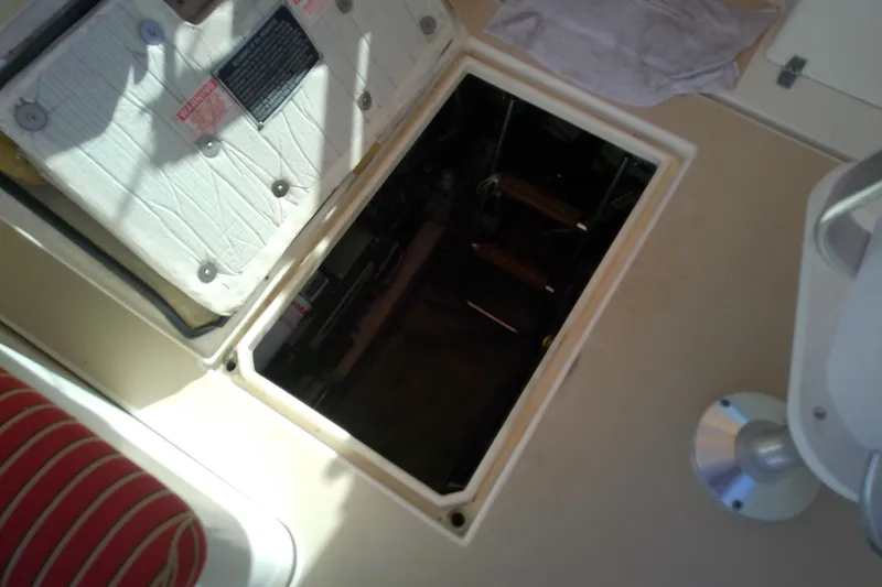 Kathrine E. Yacht Photos Pics 2002 Sabreline 36 Express engine compartment with open hatch, revealing interior components.