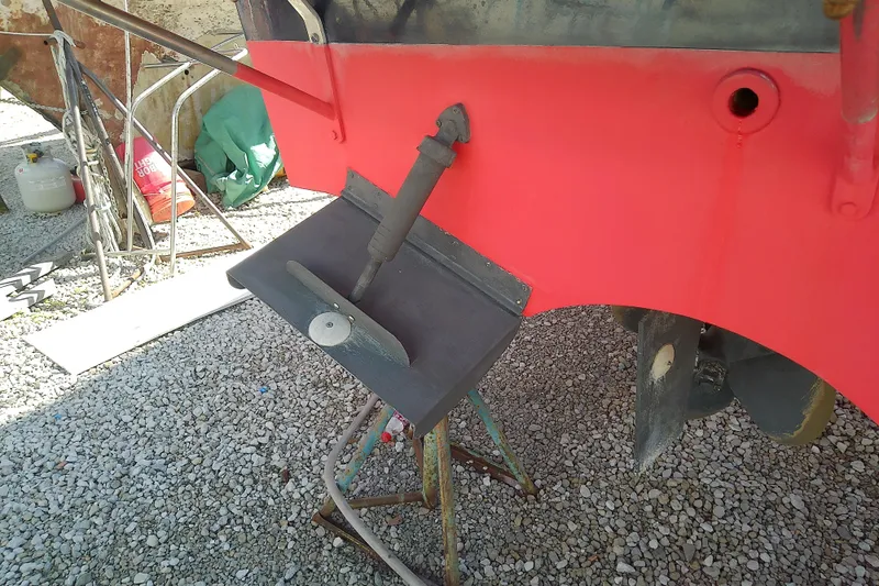 Kathrine E. Yacht Photos Pics 2002 Sabreline 36 Express boat hull with propeller and rudder on gravel.