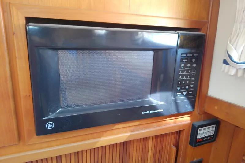 Kathrine E. Yacht Photos Pics Built-in GE microwave in 2002 Sabreline 36 Express boat kitchen.