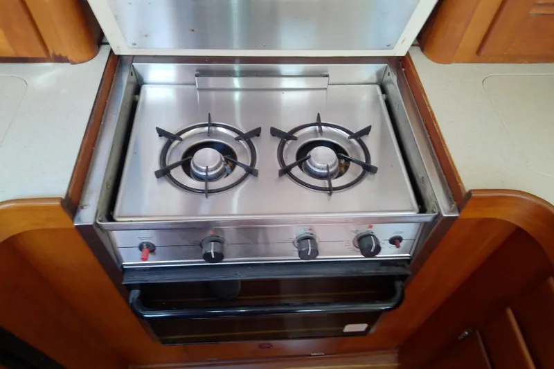 Kathrine E. Yacht Photos Pics Stainless steel stove in 2002 Sabreline 36 Express yacht kitchen.