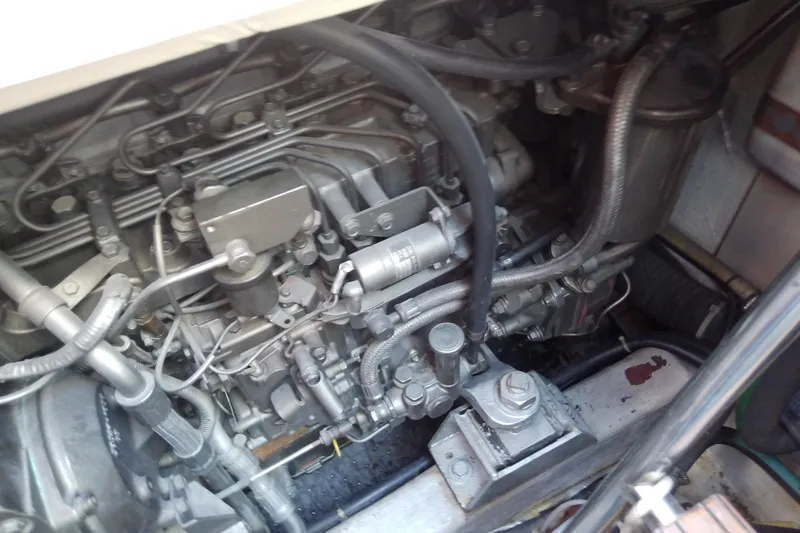 Kathrine E. Yacht Photos Pics Engine compartment of a 2002 Sabreline 36 Express boat, showcasing intricate mechanical components.