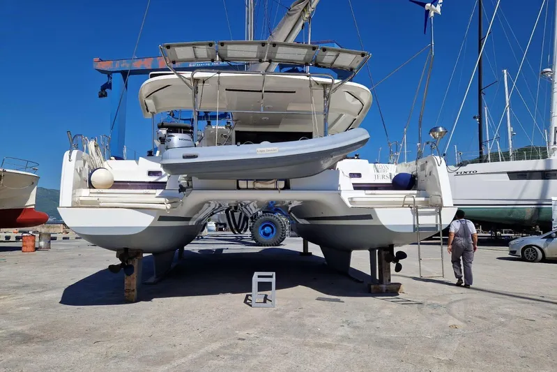  Yacht Photos Pics 2017 Lagoon 42 catamaran on dry dock, with clear blue sky background.