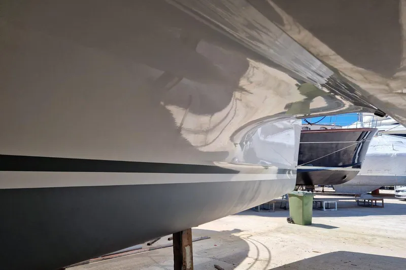  Yacht Photos Pics Side view of a 2017 Lagoon 42 catamaran hull in a boatyard.