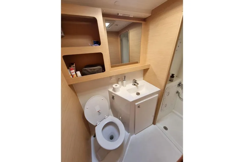  Yacht Photos Pics Modern bathroom in 2017 Lagoon 42 yacht with sink, toilet, and shower.