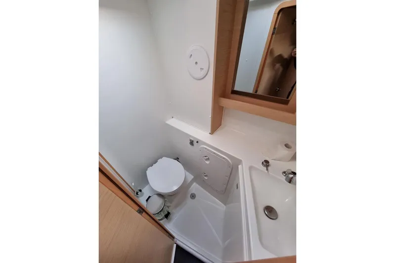  Yacht Photos Pics Bathroom interior of 2017 Lagoon 42 catamaran, featuring toilet and sink.