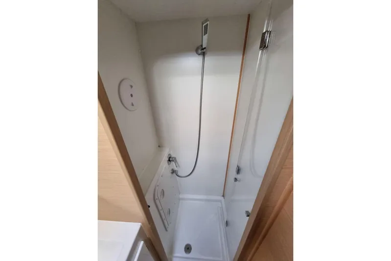  Yacht Photos Pics Shower area in 2017 Lagoon 42 catamaran, featuring modern fixtures and compact design.