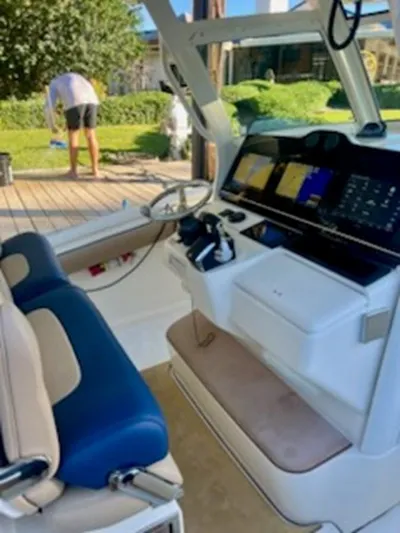 Mambo #5 Yacht Photos Pics 2017 Scout LXF 350 boat interior with modern dashboard and seating.